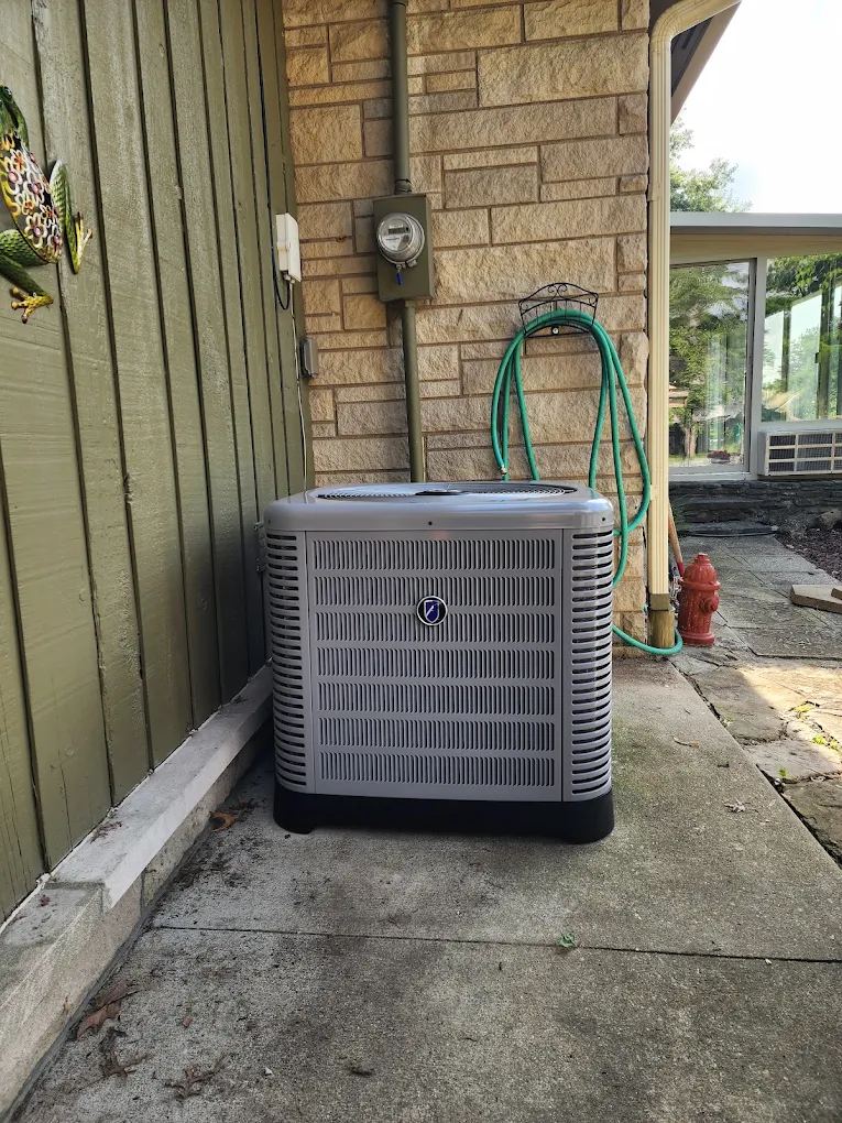New AC condenser installed at a stone home