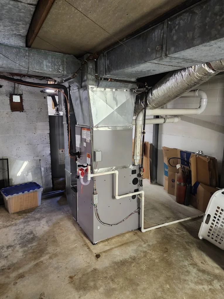 New furnace tied into original trunk ductwork in an older basement
