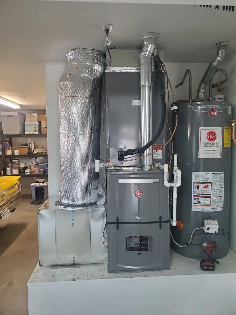 High-efficiency furnace with media filter cabinet and water heater installed by JHC Services